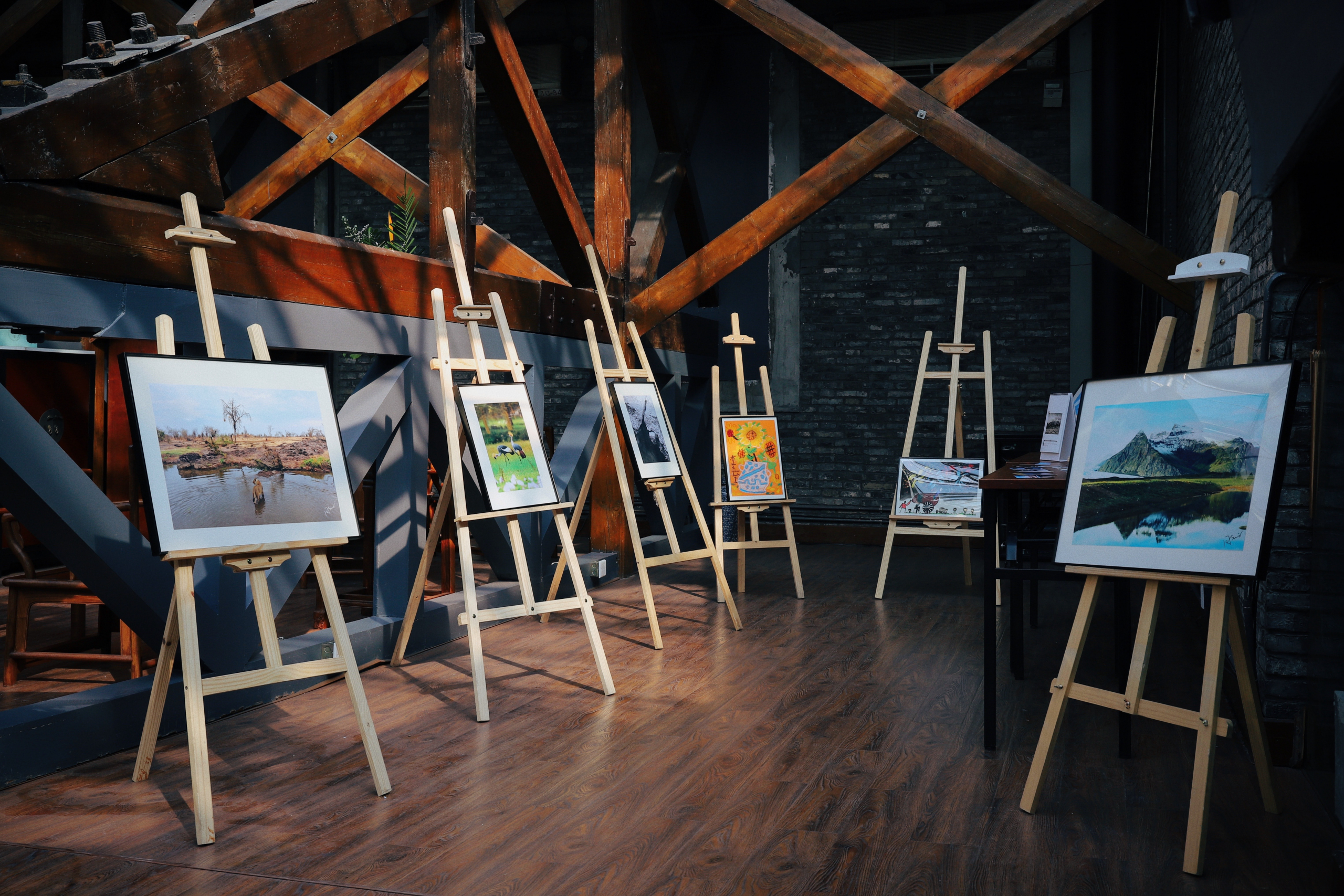 Artwork on easels in a display room