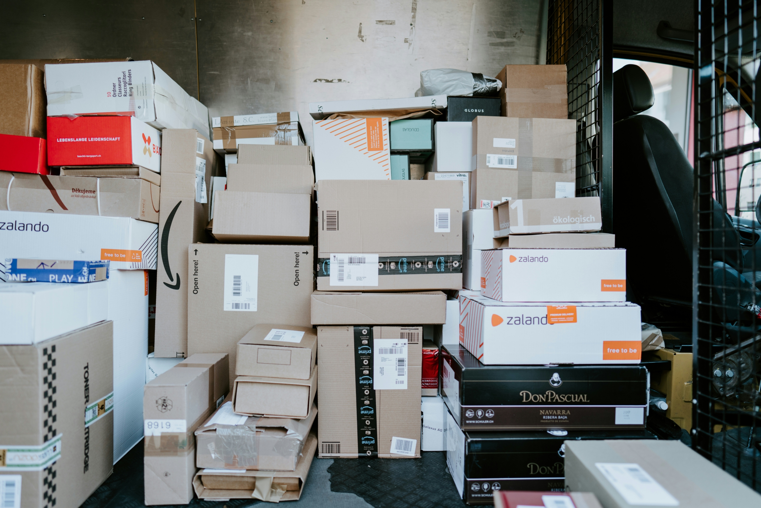 An image of a delivery van full of packages ready to be delivered with speed.