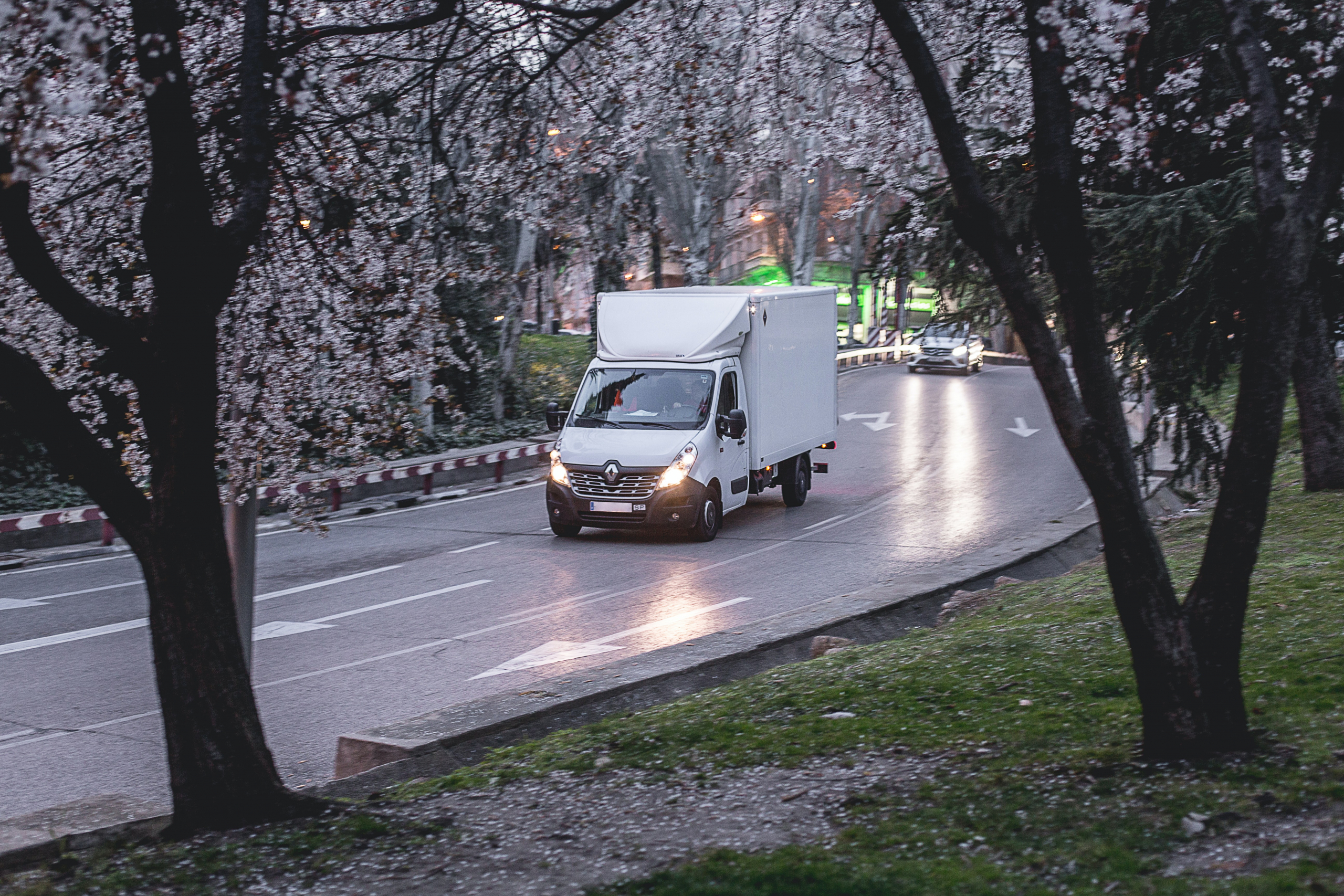 Luton van driving down a dual carraigeway at dusk